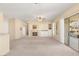 Spacious living room with a fireplace, built-in shelving, and sliding glass doors at 2000 Poppywood Ave, Henderson, NV 89012