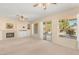 Bright living room with fireplace and sliding glass doors leading to backyard at 2000 Poppywood Ave, Henderson, NV 89012