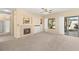 Living room with fireplace, patio access and built-ins at 2000 Poppywood Ave, Henderson, NV 89012