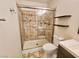 Shower with tile surround and glass door at 2253 High Dunes Ln, Laughlin, NV 89029