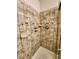 Shower with tile surround and built-in shelf at 2253 High Dunes Ln, Laughlin, NV 89029