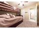 Bright bedroom with a bunk bed and access to other rooms at 2254 High Dunes Ln, Laughlin, NV 89029