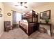 Spacious bedroom with a comfortable bunk bed and dresser at 2254 High Dunes Ln, Laughlin, NV 89029