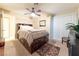 Spacious bedroom with a large bed and built-in drawers at 2254 High Dunes Ln, Laughlin, NV 89029