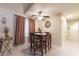 Dining area with a small table and four chairs, and a ceiling fan at 2254 High Dunes Ln, Laughlin, NV 89029