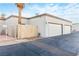 Clean exterior with two-car garage and gated access at 2254 High Dunes Ln, Laughlin, NV 89029