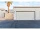 Clean exterior with a two-car garage and desert landscaping at 2254 High Dunes Ln, Laughlin, NV 89029