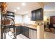 Kitchen with dark cabinets, stainless steel appliances, and granite countertops at 2254 High Dunes Ln, Laughlin, NV 89029