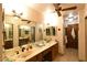 Double vanity bathroom with updated fixtures and a large mirror at 2816 Mohawk St, Las Vegas, NV 89146