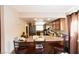 Kitchen with breakfast bar and wood cabinets at 2816 Mohawk St, Las Vegas, NV 89146