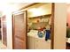 Convenient laundry area with washer, dryer, and shelving at 2816 Mohawk St, Las Vegas, NV 89146