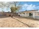 Large backyard with covered patio and mature trees at 2824 Bassler St, North Las Vegas, NV 89030