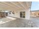 Covered patio with concrete slab and access to detached shed at 2824 Bassler St, North Las Vegas, NV 89030