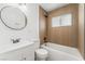 Clean bathroom with white vanity, toilet, and a bathtub at 2824 Bassler St, North Las Vegas, NV 89030