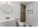 Updated bathroom with subway tile shower and wood-look wall at 2824 Bassler St, North Las Vegas, NV 89030