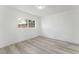 Spacious bedroom with light wood floors and a large window at 2824 Bassler St, North Las Vegas, NV 89030