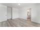 Bedroom with door to bathroom and wood-look flooring at 2824 Bassler St, North Las Vegas, NV 89030