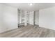 Bedroom with built-in shelving and wood-look flooring at 2824 Bassler St, North Las Vegas, NV 89030