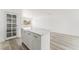 Kitchen island with white cabinets and quartz countertop at 2824 Bassler St, North Las Vegas, NV 89030