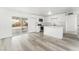 Modern white kitchen with island and stainless steel appliances at 2824 Bassler St, North Las Vegas, NV 89030