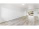 Bright living room with light gray vinyl plank flooring at 2824 Bassler St, North Las Vegas, NV 89030