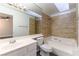 Bathroom with tile shower and updated vanity at 2983 Juniper Hills Blvd # 203, Las Vegas, NV 89142