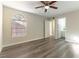 Bedroom with bathroom access and wood-look flooring at 2983 Juniper Hills Blvd # 203, Las Vegas, NV 89142