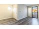 Bright entryway with laminate wood floor, door, and access to a patio at 2983 Juniper Hills Blvd # 203, Las Vegas, NV 89142