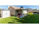 Backyard with covered patio, shed, and play area at 3123 Logan Ave, North Las Vegas, NV 89032