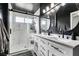 Modern bathroom with double vanity and walk-in shower at 3123 Logan Ave, North Las Vegas, NV 89032