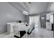 Dining area with white table and chairs, kitchen and patio views at 3123 Logan Ave, North Las Vegas, NV 89032