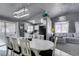 Spacious dining area with large white table and chairs at 3123 Logan Ave, North Las Vegas, NV 89032