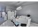 Dining room features a white table, chairs, and a view into the kitchen at 3123 Logan Ave, North Las Vegas, NV 89032