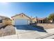 Charming single story home with attached garage and gravel driveway at 3123 Logan Ave, North Las Vegas, NV 89032