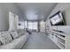 Living room with sectional sofa, large TV, and entryway view at 3123 Logan Ave, North Las Vegas, NV 89032