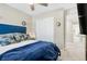 Bright bedroom with a blue bedspread and plenty of closet space at 3296 Palindrome Ave, Henderson, NV 89044