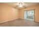 Bedroom with ceiling fan, carpeting, and access to a private balcony at 3320 S Fort Apache Rd # 125, Las Vegas, NV 89117