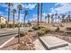 Landscaped community entrance with a gated access and signage at 3320 S Fort Apache Rd # 125, Las Vegas, NV 89117