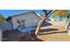 Spacious backyard with gravel, patio, and a tree at 3330 Trotting Horse Rd, North Las Vegas, NV 89032