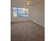 Spacious bedroom with carpeted floor and window at 3425 E Russell Rd # 265, Las Vegas, NV 89120