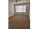 Bright bedroom with carpeted floor and window at 3425 E Russell Rd # 265, Las Vegas, NV 89120