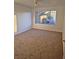 Large bedroom with carpeted floor and window at 3425 E Russell Rd # 265, Las Vegas, NV 89120