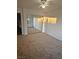 Carpeted bedroom with mirrored closet doors and ceiling fan at 3425 E Russell Rd # 265, Las Vegas, NV 89120