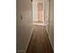 Long hallway with wood-look flooring at 3425 E Russell Rd # 265, Las Vegas, NV 89120