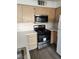 Bright kitchen features stainless steel appliances and wood cabinets at 3425 E Russell Rd # 265, Las Vegas, NV 89120