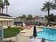 Community pool with patio furniture and landscaping at 3425 E Russell Rd # 265, Las Vegas, NV 89120