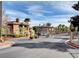 Gated community entrance with landscaping and signage at 3820 Wiggins Bay St # 201, Las Vegas, NV 89129