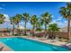 Large community pool with plenty of lounge chairs at 3820 Wiggins Bay St # 201, Las Vegas, NV 89129