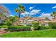 Community pool area with lush landscaping and mountain views at 3820 Wiggins Bay St # 201, Las Vegas, NV 89129