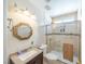 Bright bathroom featuring a vanity with granite countertops and a glass enclosed shower at 433 Jubilation Dr, Las Vegas, NV 89145